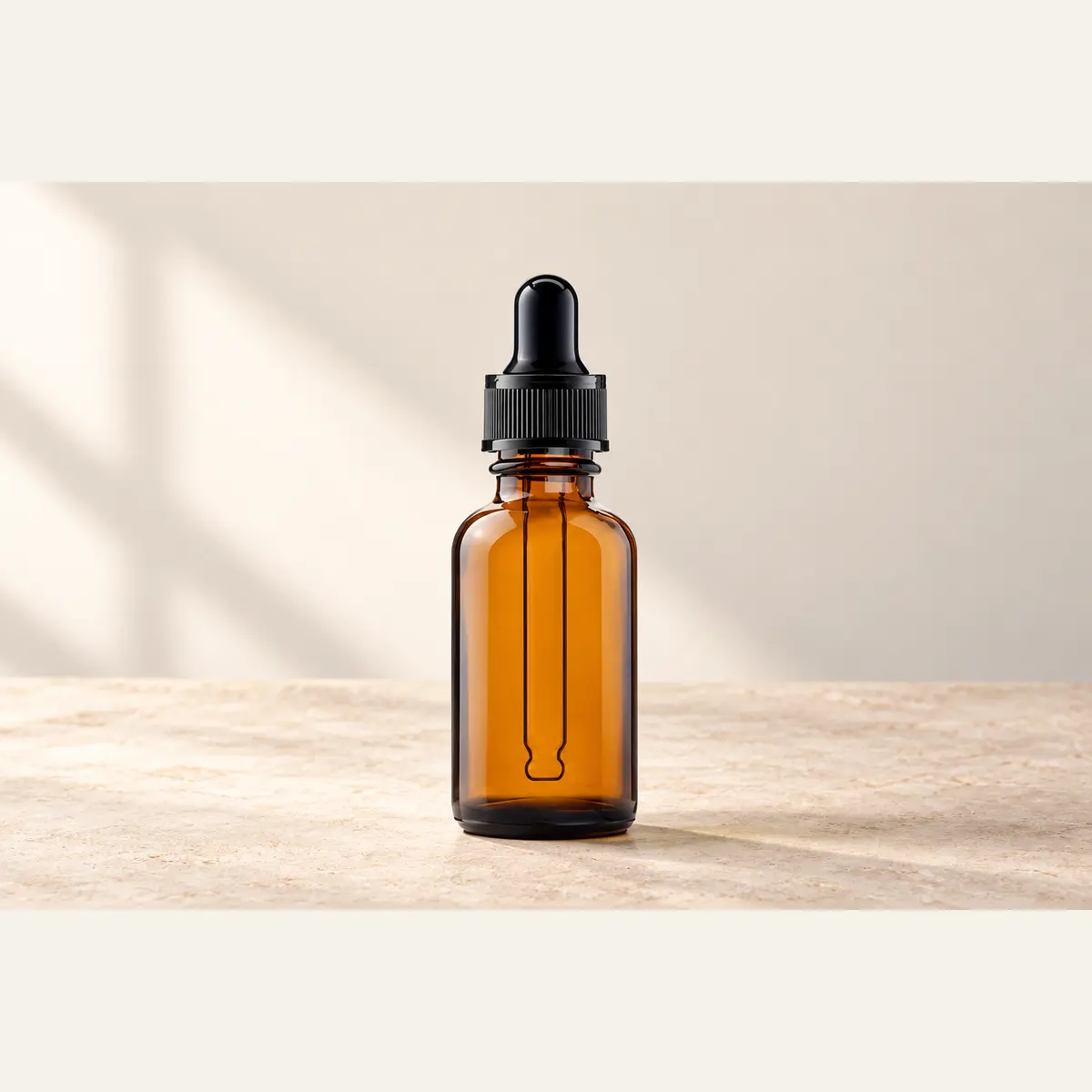 Amber Dropper Bottle photographed on a warm neutral studio background