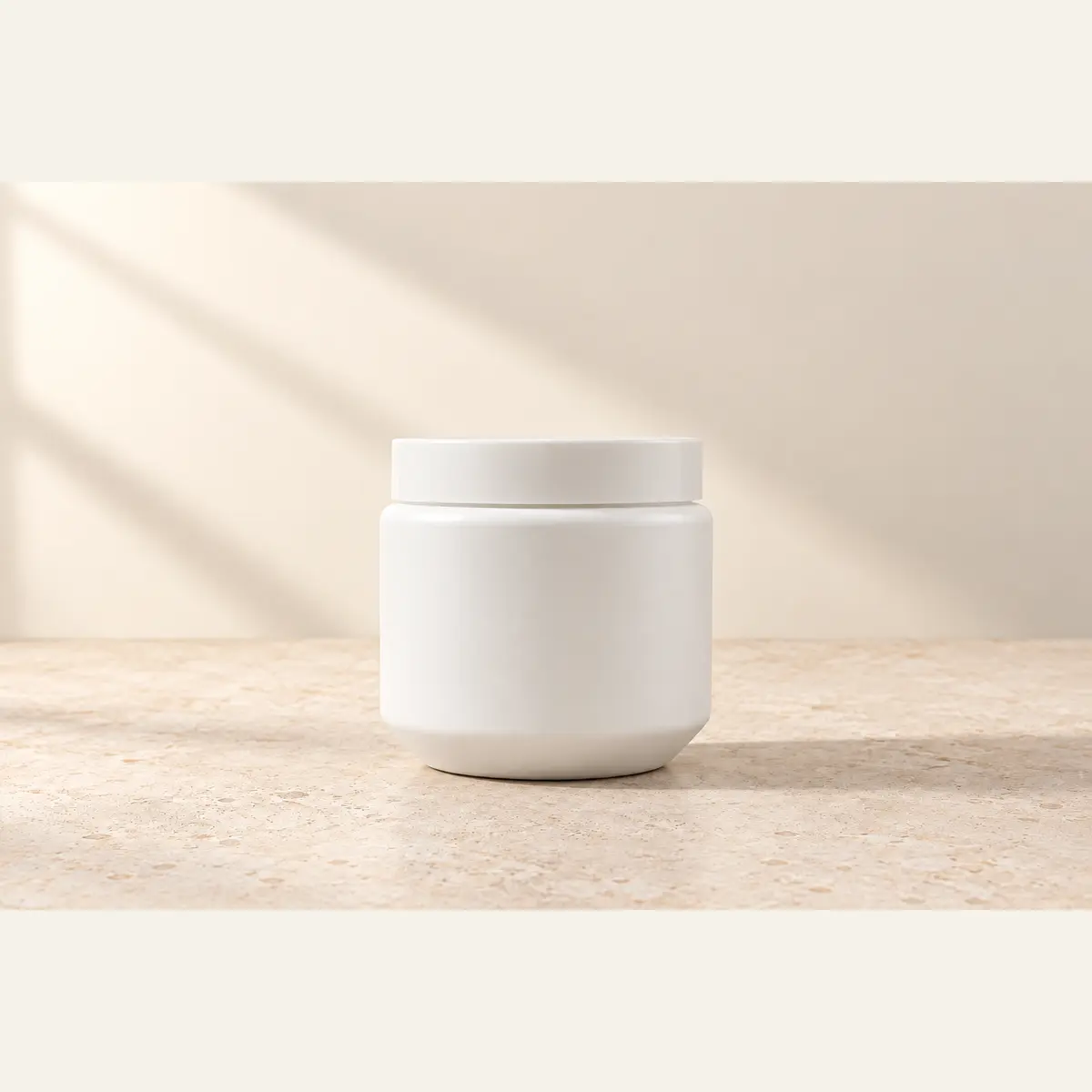 White 500 g HDPE Jar photographed on a warm neutral studio background