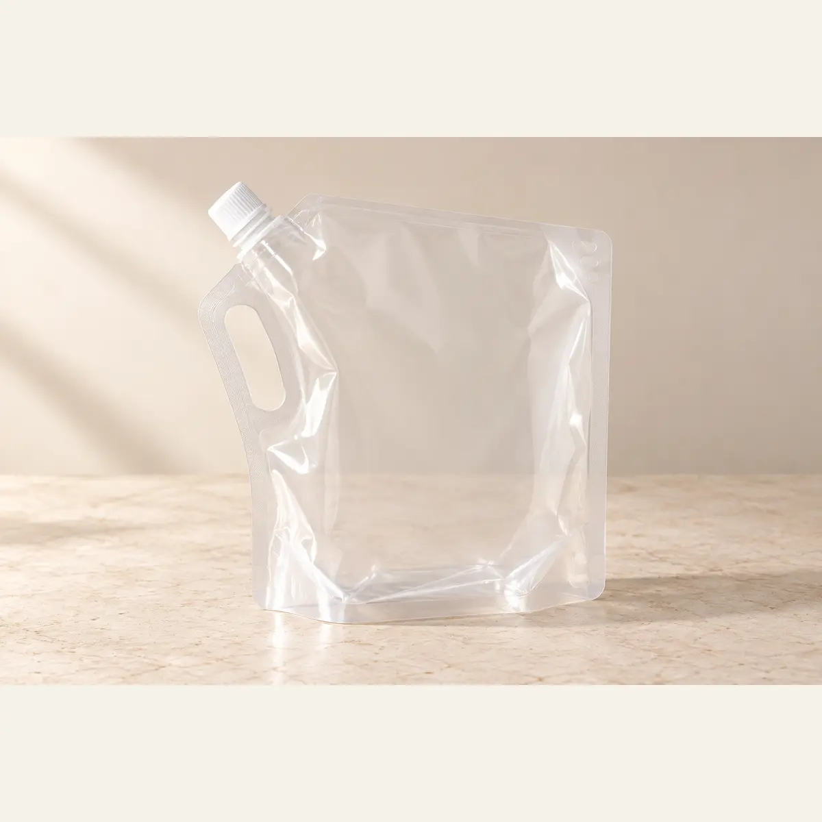 Clear Corner-Spout Refill Pouch photographed on a warm neutral studio background
