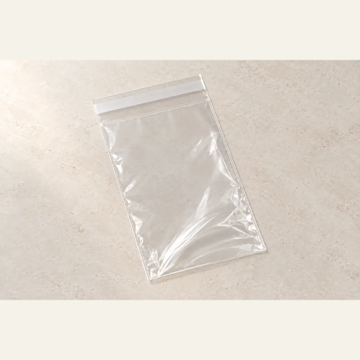 Clear Self-Seal Product Bag · 10 × 15 cm photographed on a warm neutral studio background