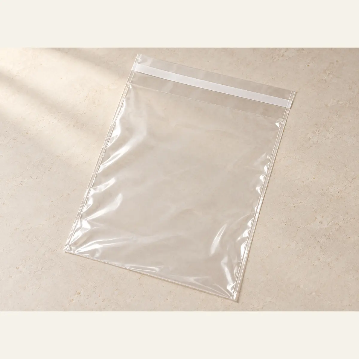 Clear Self-Seal Product Bag · 25 × 34 cm photographed on a warm neutral studio background