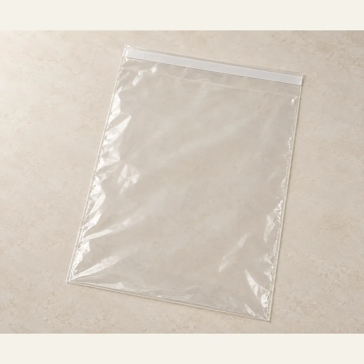 Clear Self-Seal Product Bag · 30 × 42 cm photographed on a warm neutral studio background