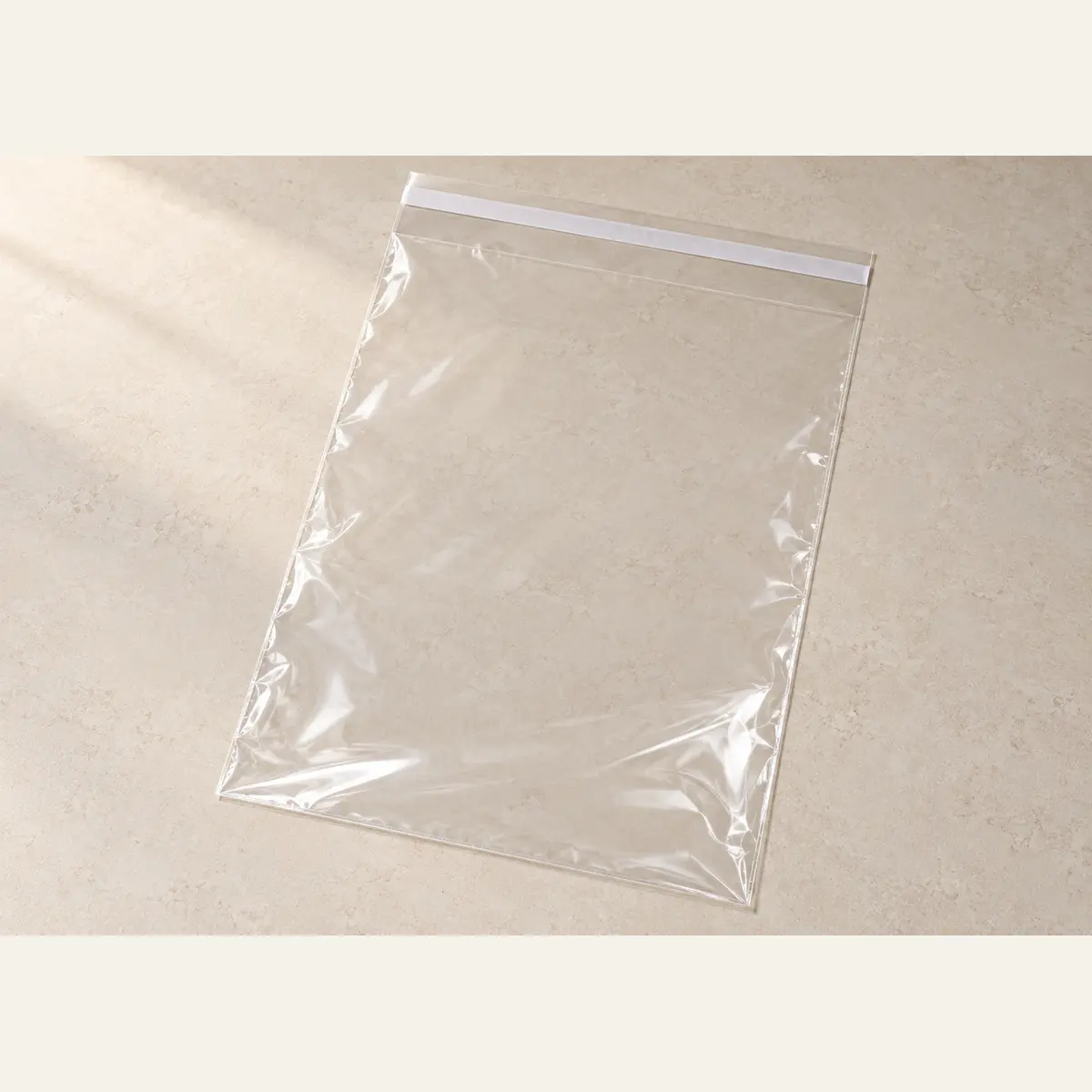 Clear Self-Seal Product Bag · 35 × 50 cm photographed on a warm neutral studio background