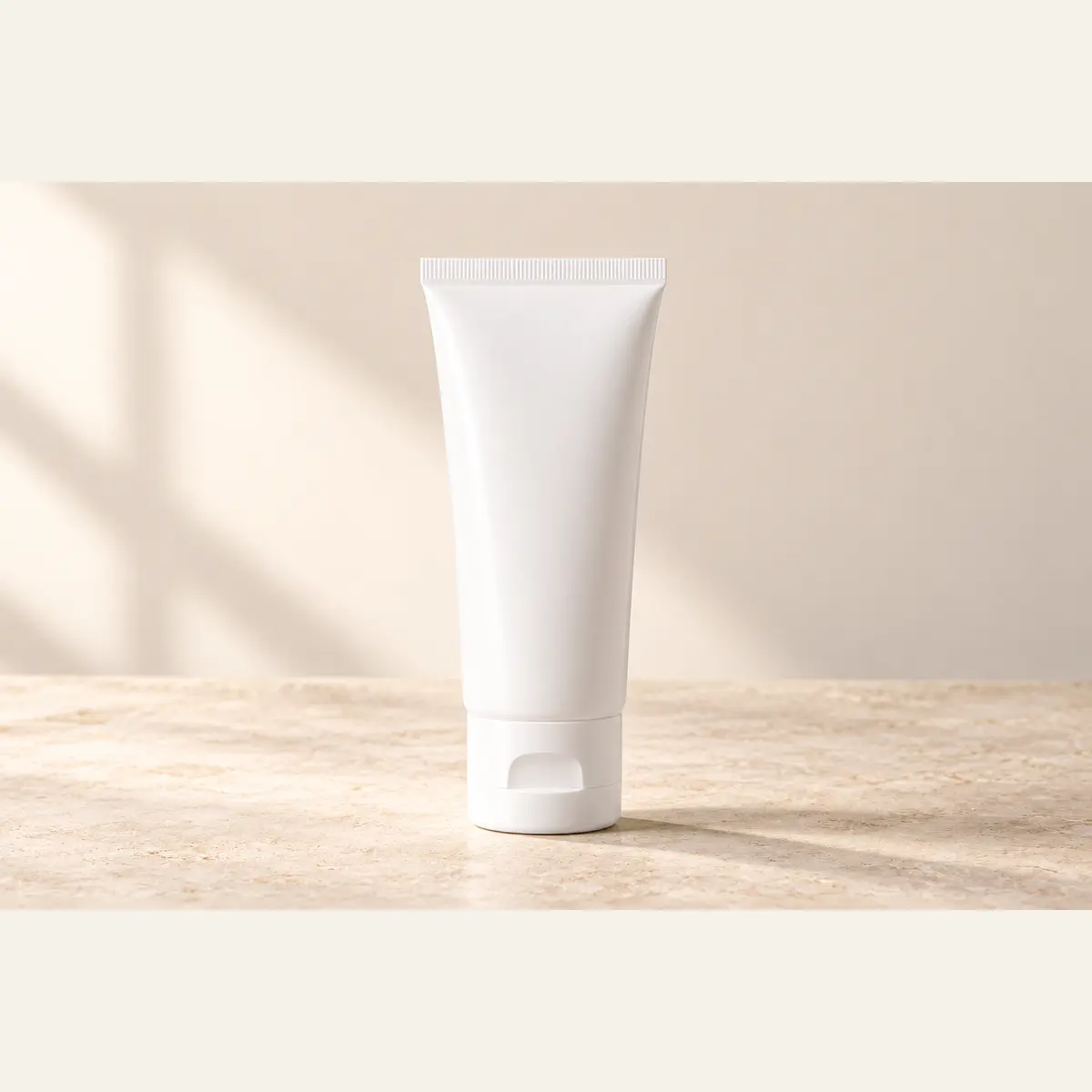 White Cosmetic Tube photographed on a warm neutral studio background